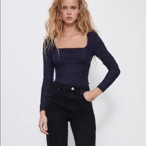 Long sleeve bodysuit. New with tags!